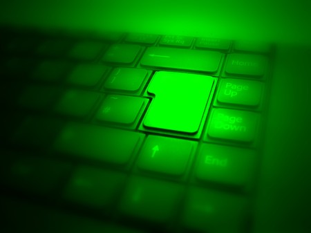 Big highlighted green button on keyboard. See also different versions!の写真素材