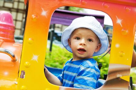 A young child enjoying funfairの写真素材