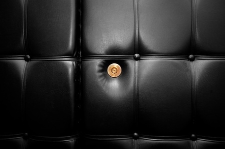 Gold peephole in luxury black leather door in retro style. Conceptualの写真素材