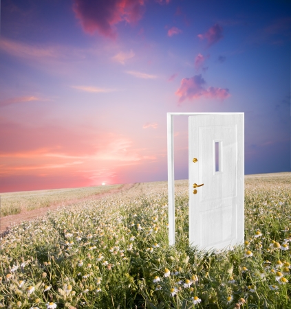 Open door to new life on the field. Hope, success, new life and world concepts.の写真素材
