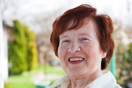 Happy senior woman smiling outdoor
