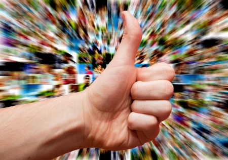 Social media concept with hand in LIKE or okayの写真素材