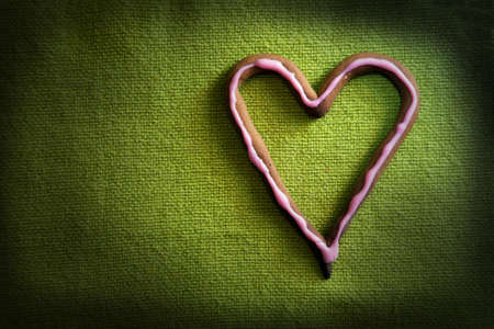 Heart shape candy on green background. Ideal for Valentineの写真素材