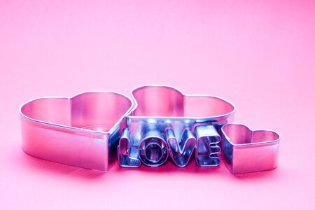 Hearts and love letters text on pink background. Ideal for Valentineの写真素材