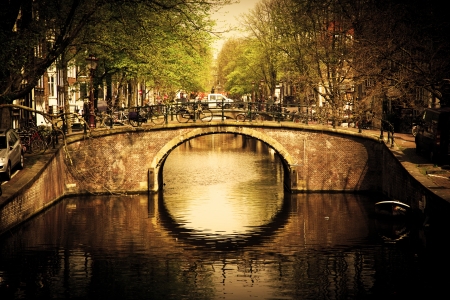 Amsterdam, Holland, Netherlands. Romantic bridge over canal. Old townの写真素材