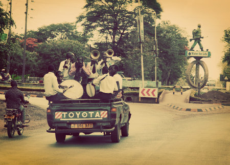 ARUSHA, TANZANIA in AFRICA - DECEMBER 10: A group of young men celebrating their graduation from the...