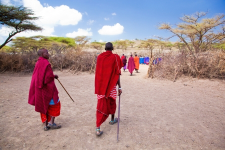 Maasai village, TANZANIA, AFRICA - DECEMBER 11: A group of Maasai people in traditional clothes in front of their village on December 11, 2012 in Tanzania. Maasai people are among the best known of African ethnic groups located in Kenya and northern Tanzaのeditorial素材