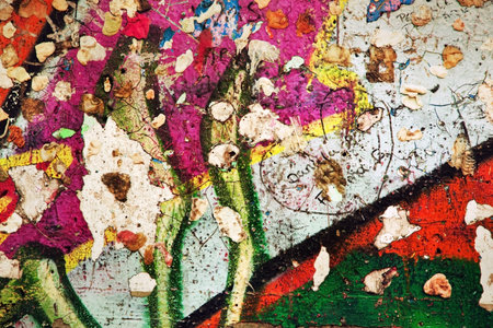 Part of Berlin Wall with graffiti and chewing gums stuck on it. Potsdamer Platz, Berlin, Germany