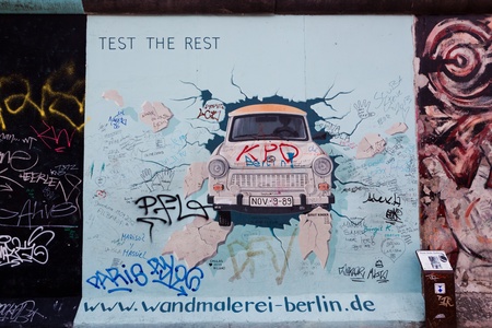 BERLIN, July 26  Graffiti at the East Side Gallery on July 26, 2013 in Berlin, Germany  Possibly the largest and longest open air gallery in the world  East Side Gallery documents a time of change and express the euphoria and great hopes for a better futuのeditorial素材