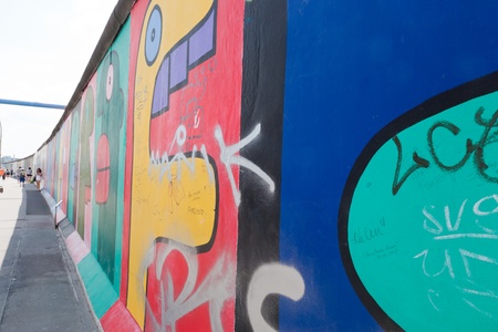BERLIN, July 26  Graffiti at the East Side Gallery on July 26, 2013 in Berlin, Germany  Possibly the largest and longest open air gallery in the world  East Side Gallery documents a time of change and express the euphoria and great hopes for a better futuのeditorial素材