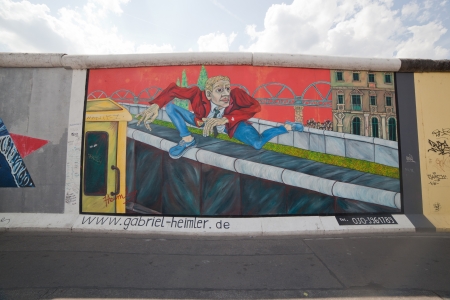 BERLIN, July 26  Graffiti at the East Side Gallery on July 26, 2013 in Berlin, Germany  Possibly the largest and longest open air gallery in the world  East Side Gallery documents a time of change and express the euphoria and great hopes for a better futuのeditorial素材