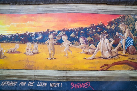 BERLIN, July 26  Graffiti at the East Side Gallery on July 26, 2013 in Berlin, Germany  Possibly the largest and longest open air gallery in the world  East Side Gallery documents a time of change and express the euphoria and great hopes for a better futuのeditorial素材