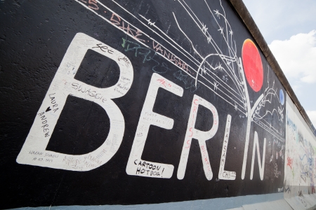 BERLIN, July 26  Graffiti at the East Side Gallery on July 26, 2013 in Berlin, Germany  Possibly the largest and longest open air gallery in the world  East Side Gallery documents a time of change and express the euphoria and great hopes for a better futuのeditorial素材