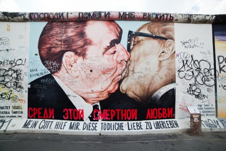 BERLIN, July 26  Graffiti at the East Side Gallery on July 26, 2013 in Berlin, Germany  Possibly the largest and longest open air gallery in the world  East Side Gallery documents a time of change and express the euphoria and great hopes for a better futuのeditorial素材