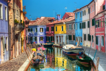 Colorful houses and canal on Burano island, near Venice, Italy. Sunny day. Colorful houses and canal on Burano island, near Venice, Italy. Sunny day.