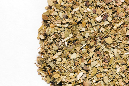 Dry Yerba Mate leaves on white background. A popular South American drink known for giving energy...