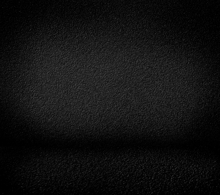 Black minimalist grainy wall background and black floor. High resolution, good for templates, backgrounds, textures.の写真素材