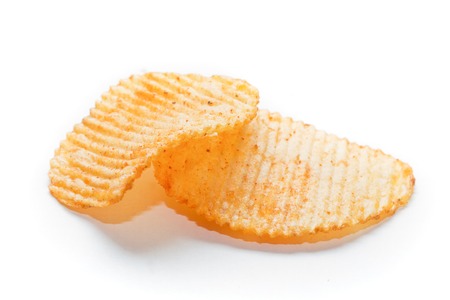 Two spiced potato chips isolated on white backgroundの写真素材