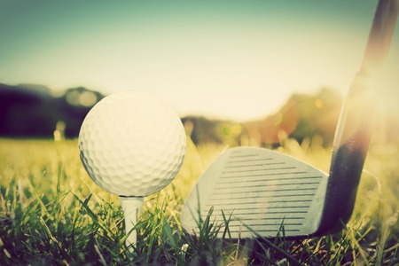 Playing golf, ball on tee and golf club about to shot. Vintage, retro styleの写真素材