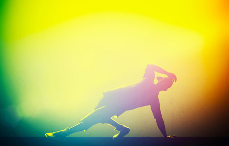 Hip hop, break dance performed by young man in colorful club lights  Breakdance party time