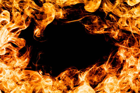 Fire flames on black background making a frameの写真素材