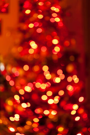 Christmas tree background of true camera bokeh. Glitter and light abstract.の写真素材