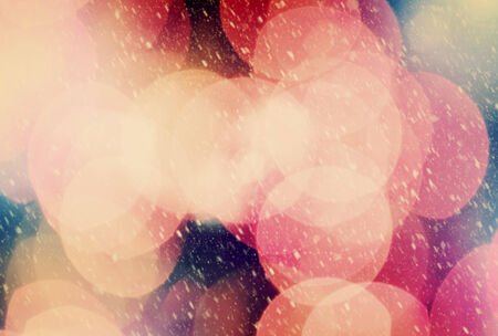 Christmas background of true camera bokeh. Snow blizzard texture. Glitter and light abstract.の写真素材