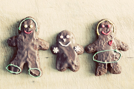 Gingerbread family. Handmade in home, decorated by children. Vintage Christmas