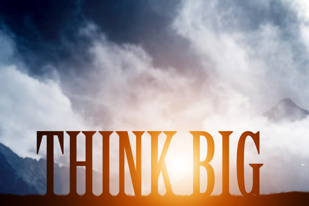 THINK BIG text on mountains landscape at sunset dramatic sky. Motivational, inspirationalの写真素材