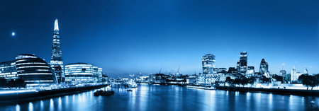 London skyline panorama at night, England the UK in lights. Tower of London, The Shard, City Hall,...