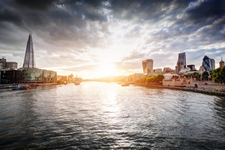 London skyline at sunset, England the UK. Tower of London, City Hall, River Thames. Seen from Tower Bridgeのeditorial素材