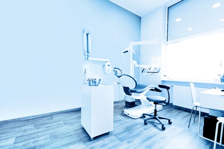 Dentist's office. Dental equipment in modern, clean interior. Blue toneの写真素材