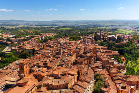 Siena, Italy panoramic rooftop city view. Medieval architecture. As seen from Mangia Tower, Italian...