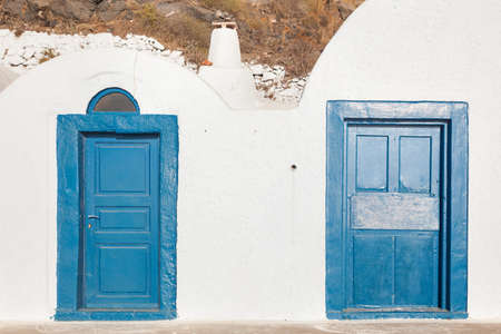Grunge old blue doors in Oia town, Santorini, Greece. Conceptual.の写真素材