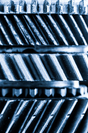 Gears, grunge cogwheels, real engine elements close-up background. Heavy industry, concepts of...