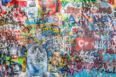 PRAGUE, CZECH REPUBLIC - APRIL 29, 2016: John Lennon Wall has been filled with Lennon inspired graffiti and lyrics from Beatles' songs since the 1980s as irritation of the communist regime.のeditorial素材