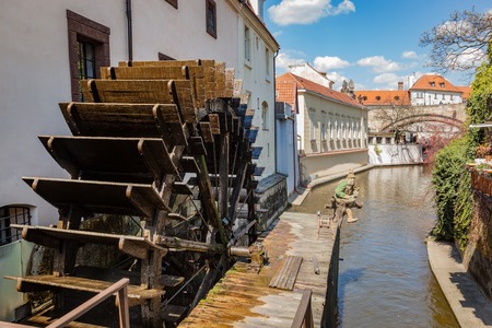 Historic water mill on Kampa Island in Prague, Czech Republic. Branch of the Vltava river, the Certovka or Devil's Streamの写真素材