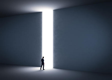 Businessman about to cross the entrance to the light. Concept of challenge in life, career etc. 3D illustrationの写真素材