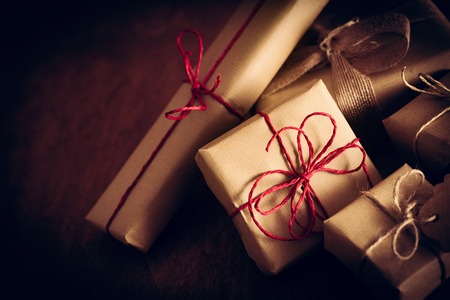 Rustic retro gifts, present boxes. Christmas time, vintage mood. Handmade eco paper wrap.の写真素材