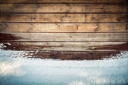 Grunge wooden board in snow. Winter time backgroundの写真素材