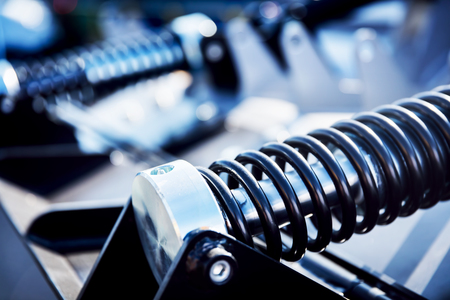 Black spring attached to a metal black manufacturing component. Railway industryの写真素材