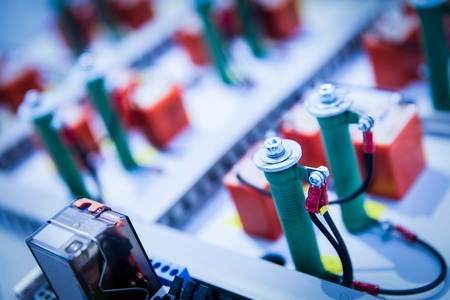 Wires attached to log metal engineering elements. Close-up shot. Railway industryの写真素材