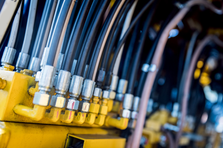 Row of electronic cables connected to a complex machinery. Railway industryの写真素材