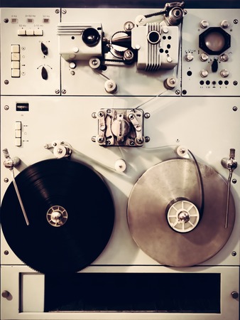 Antique recording machine with film tapes, reels and switches. Vintage movie industry.の写真素材