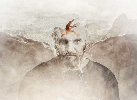 Multiple exposure composition of man jumping between the mountains blended into man's head.