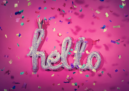 HELLO balloon and falling confetti. Party, birthday celebration. Colorful festive decoration.