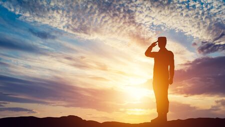 Soldier saluting. Sunset sky, sun shining. Army, salute, patriotic concept. 3D illustrationの写真素材