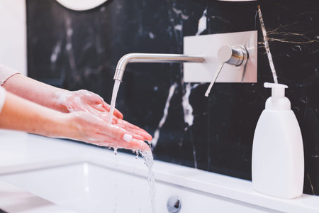 Washing hands with foam soap. Hygiene and healthcare, preventing coronavirus.
