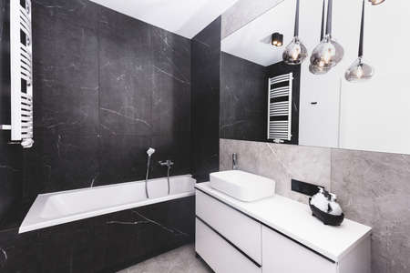 Modern new luxury bathroom. Interior design in black and white styleの写真素材