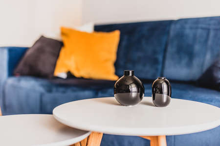 Table and couch in a living room in a modern apartment for rent. Interior designの写真素材